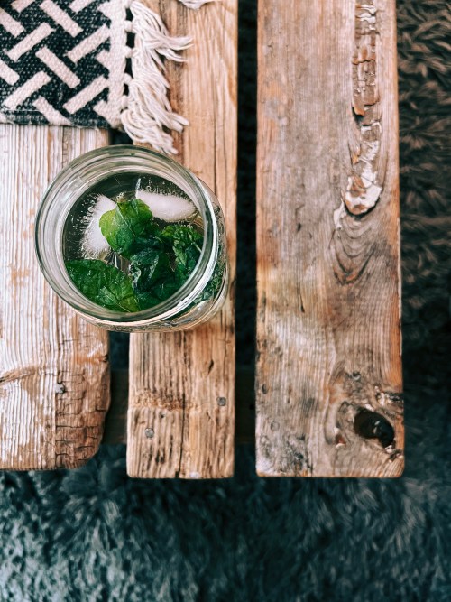 Vintage wooden furniture and reclaimed pieces styled together
