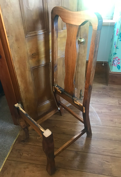 Antique wooden dining chair broken apart at the joints, before restoration