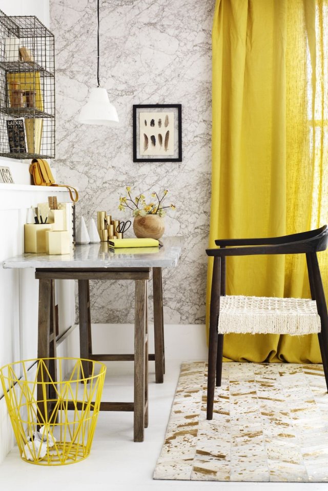 Home office corner with bright yellow curtains and matching accessories