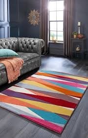 Colourful geometric rug brightening a dark living room