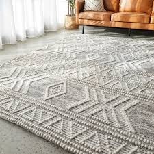 Textured woven rug with a geometric pattern